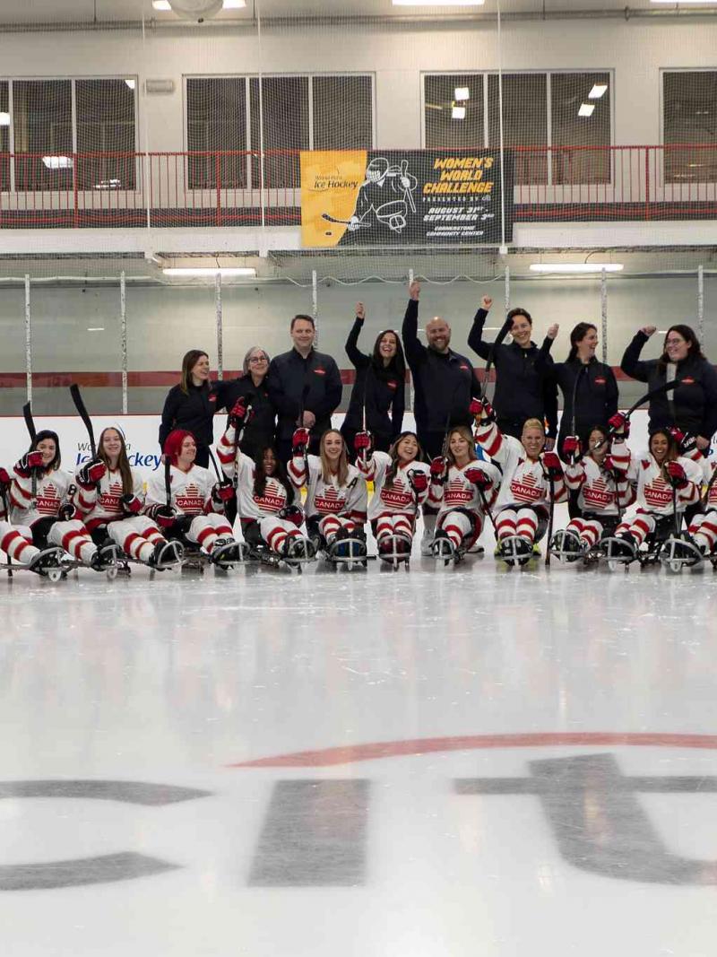 Players pose for a group picture after a match