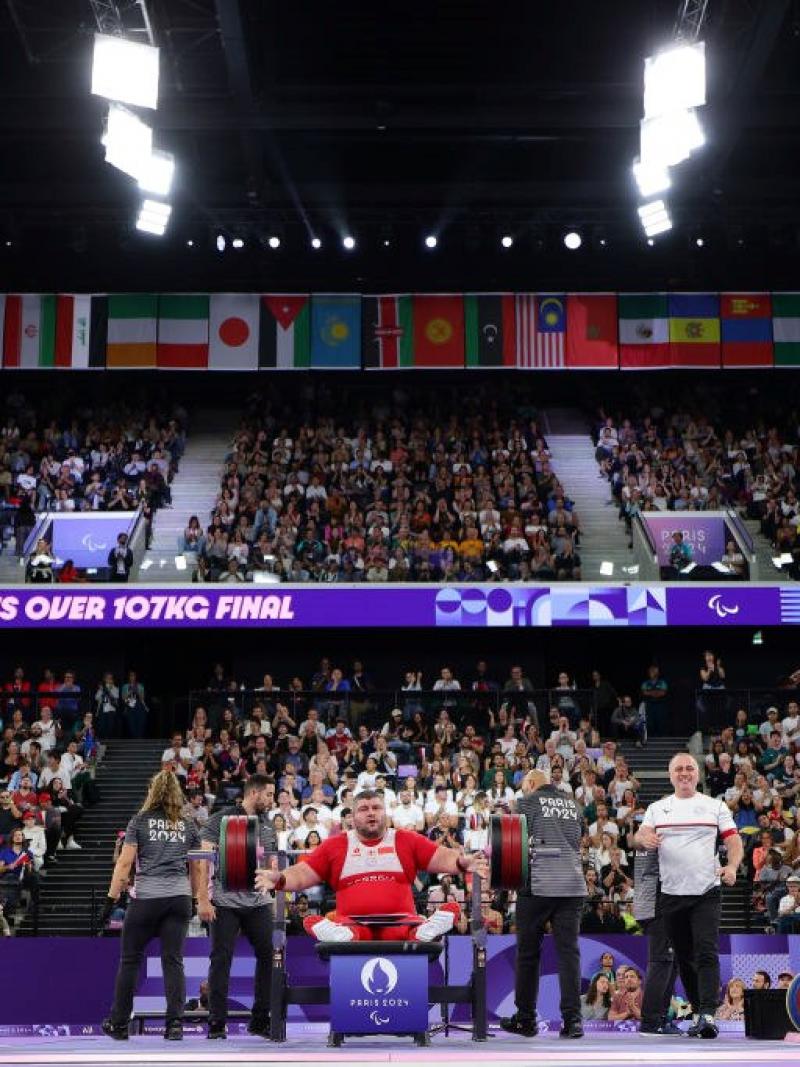 A packed arena watching a Para powerlifting competition