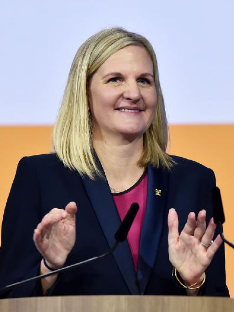 A female official is speaking in a press conference.