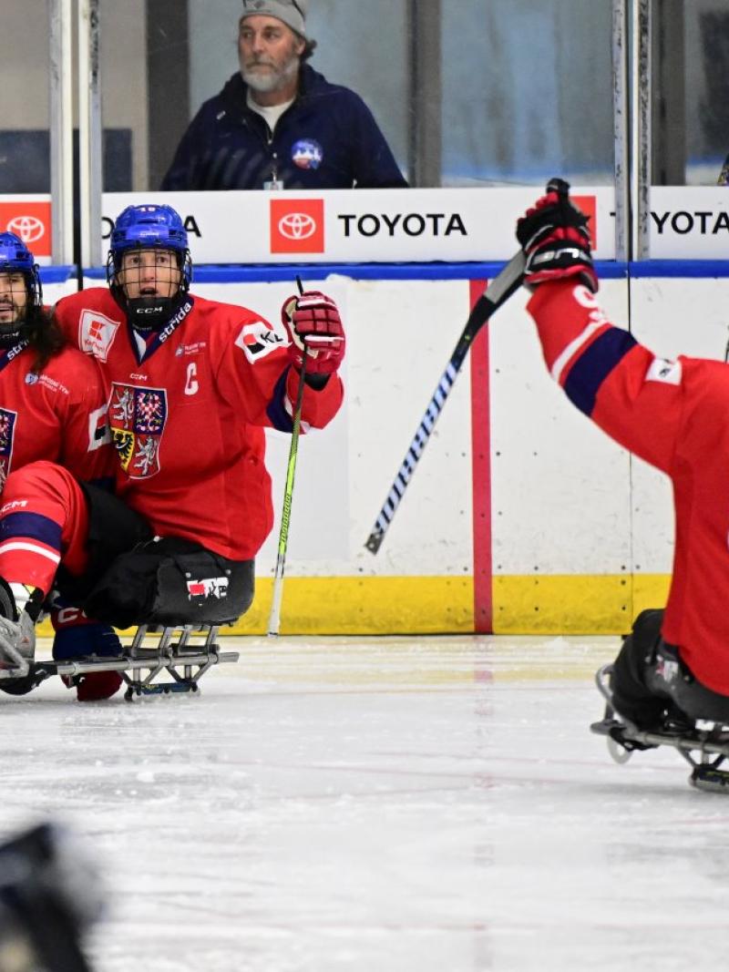 Four Czech Para ice hockey players celebrating on ice