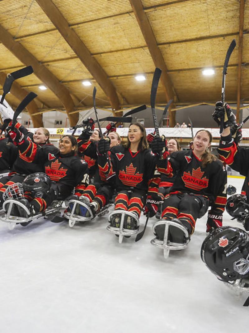 The Canadian women's Para ice hockey team waving to the crowd