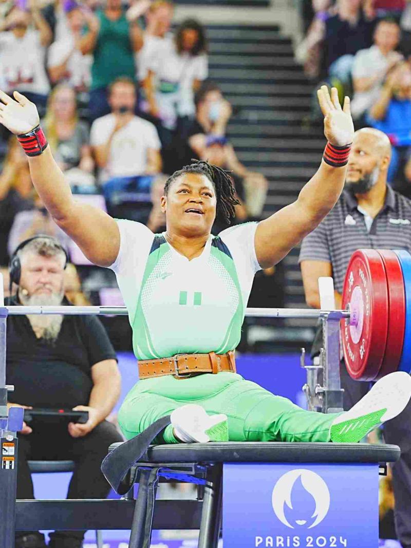An athlete reacts after a successful lift