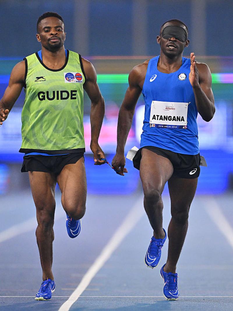 An athlete and guide in action