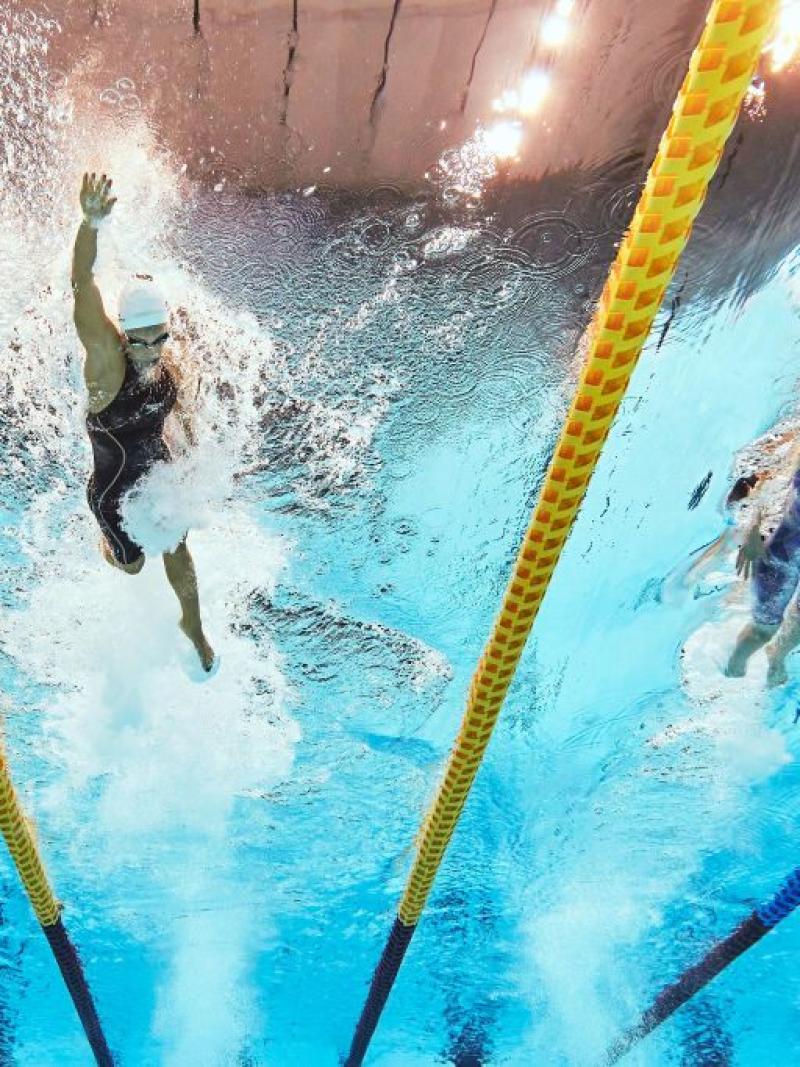 Underwater image of two female swimmers competing