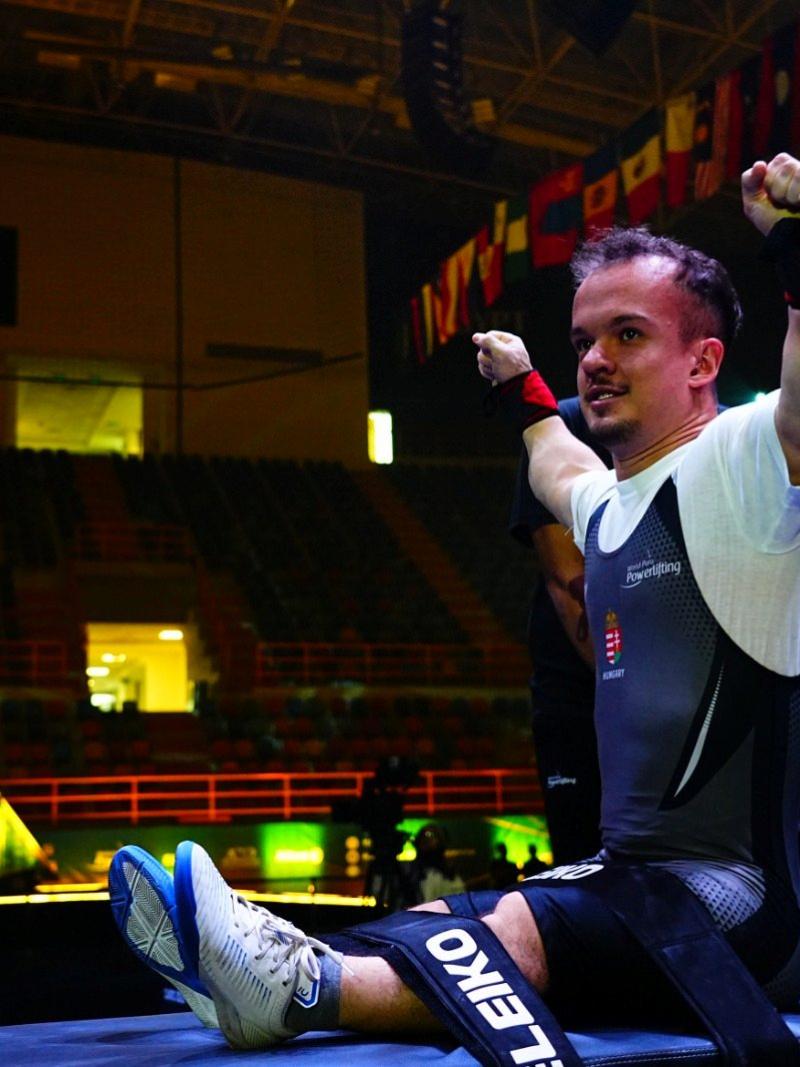 An athlete reacts after a successful lift