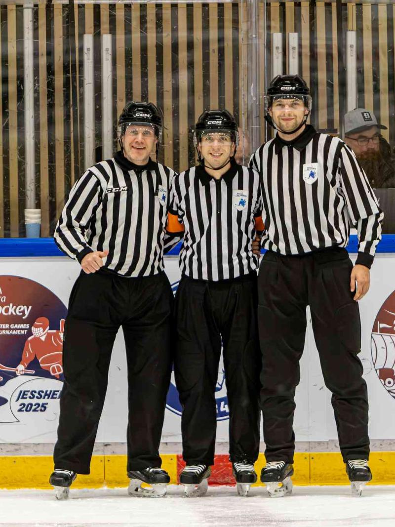 Officials pose after a match