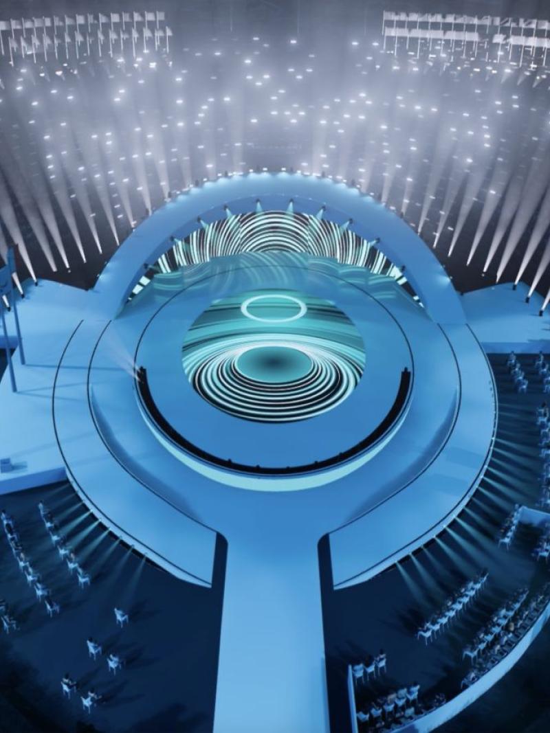 A mockup of the venue of the Paralympic Opening Ceremony with a blue stage in an outdoor venue