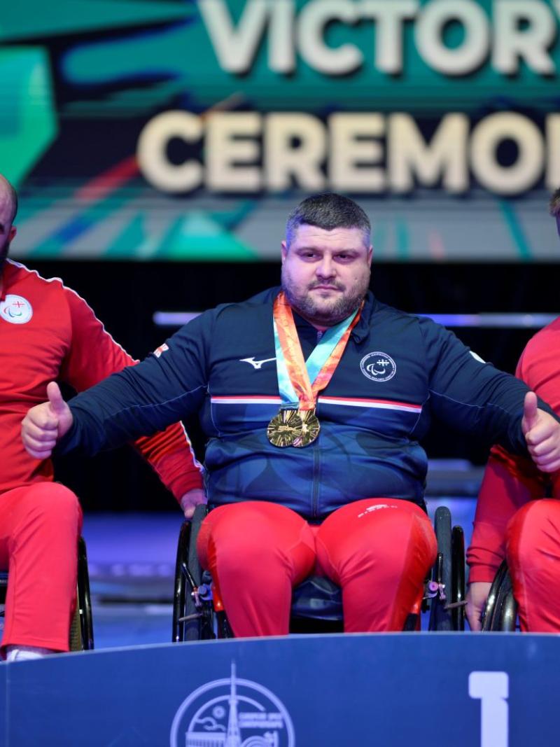Athletes celebrate on podium