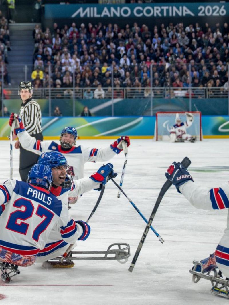 Four USA para ice hockey players celebrating on the Milano Cortina 2026 ice rink