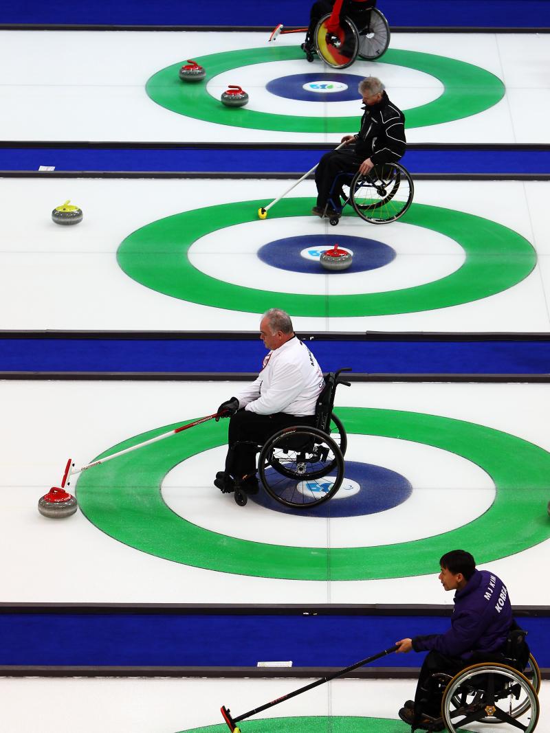 Athletes practicing Wheelchair Curling