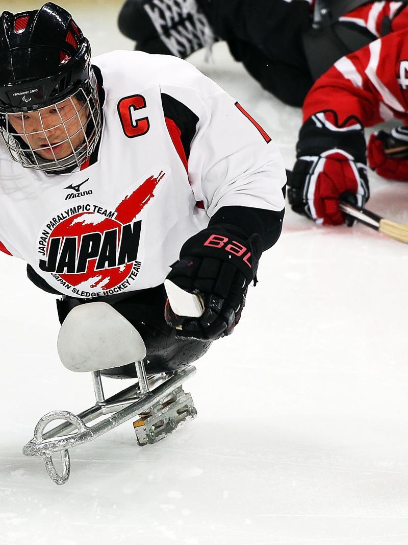 Japanese Ice Sledge Hockey player performing against Canada at Vancouver 2010