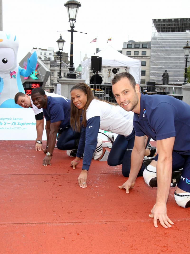 Oscar Pistorius (RSA), April Holmes (USA), Jerome Singleton (USA) and Heinrich Popow (GER) preparing for a friendly 100m race during the 2011 International Paralympic Day in Trafalgar Square in London, Great Britain