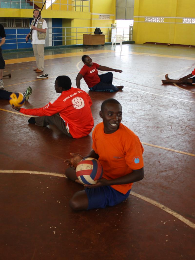 athletes practicing sitting volleyball