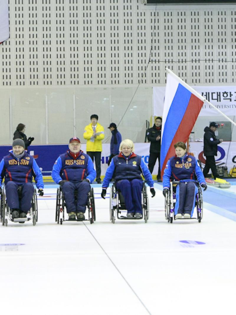 Gold winner Team Russia celebrating at the Medal Ceremony of the 2012 Wheelchair Curling World Championships in Chuncheon, Korea
