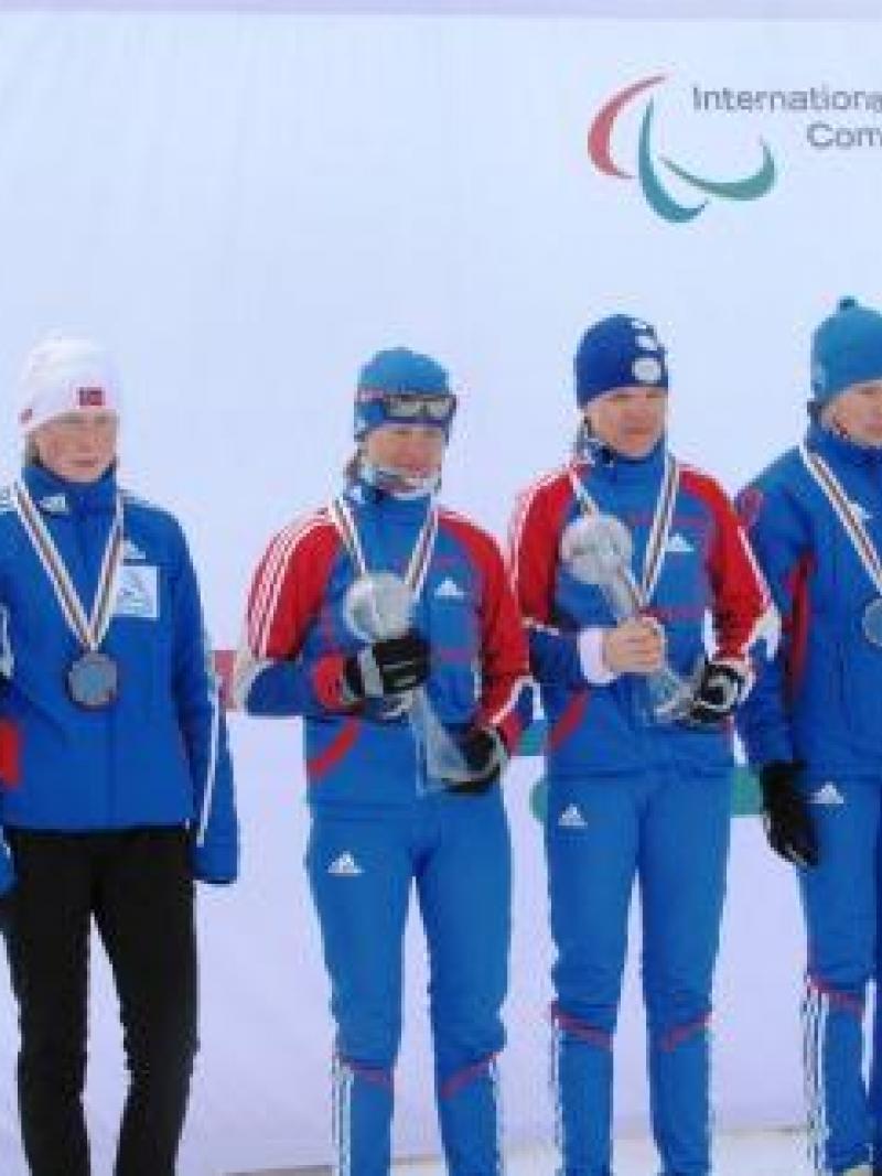 Three women on podium