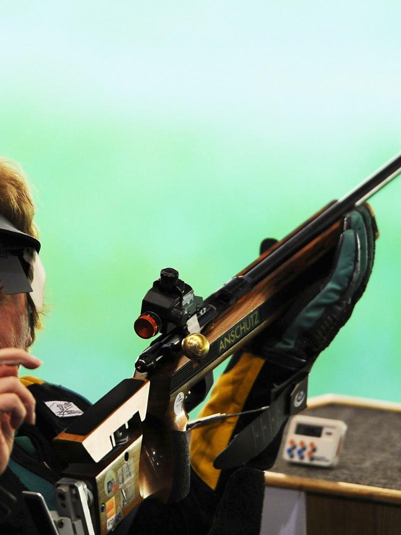 shooter holding gun