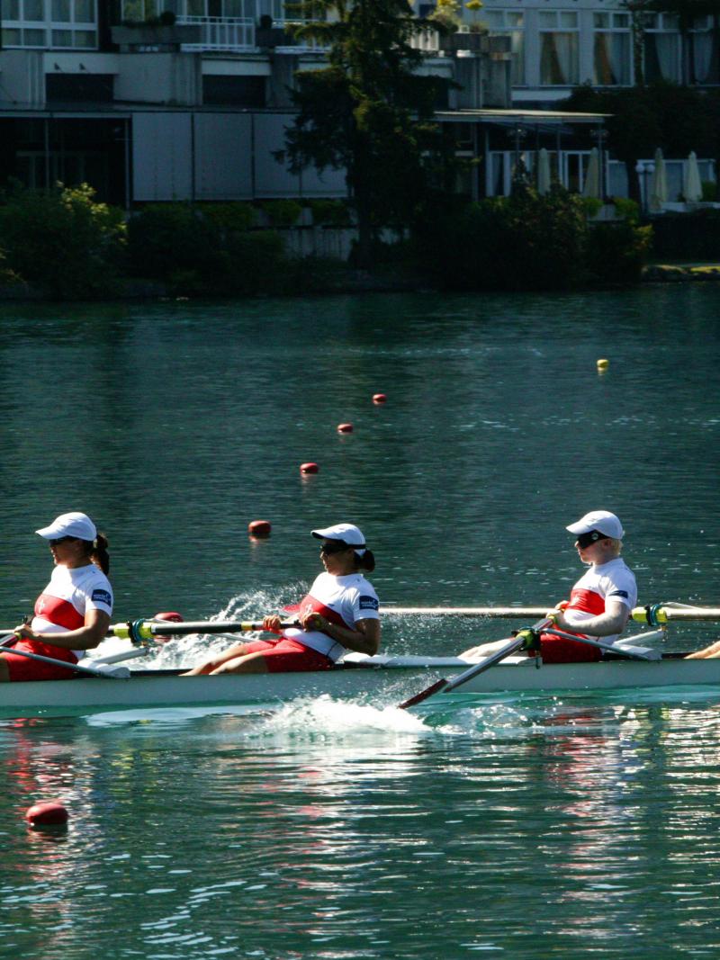 A picture of 4 people rowing