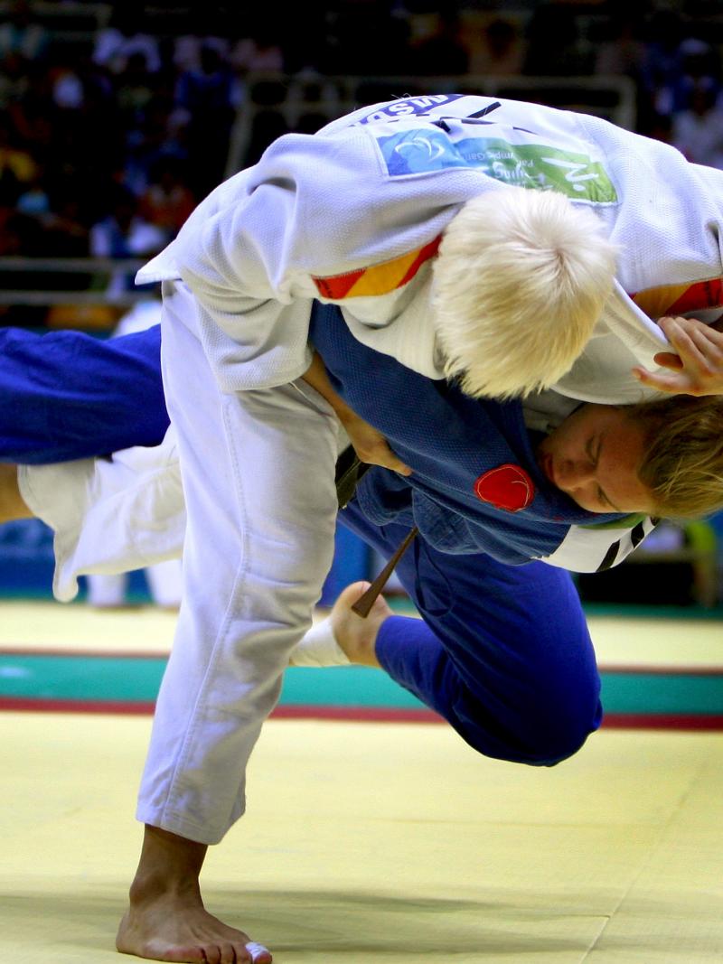 a picture of 2 athletes competing in a judo match