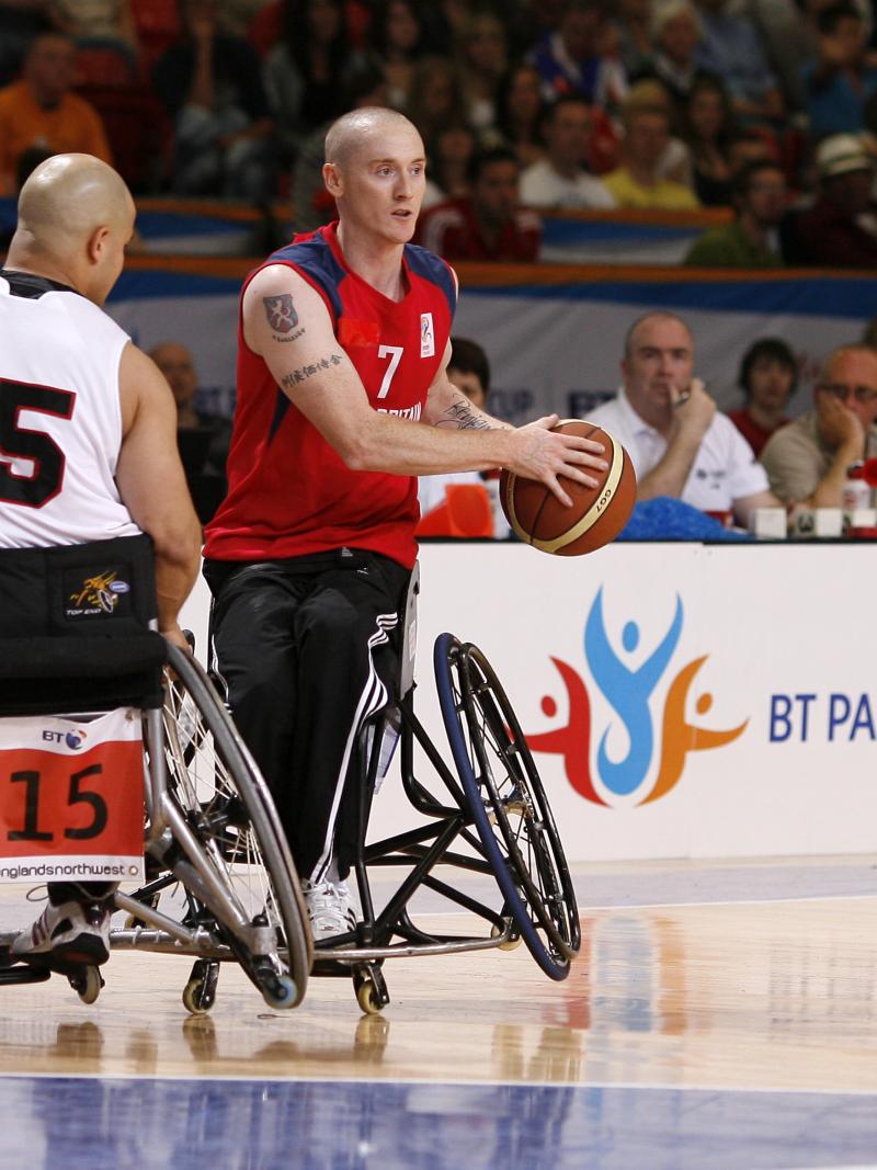A picture of a person in a wheelchair playing basketball