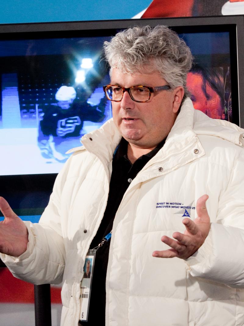 A picture of a person standing and talking