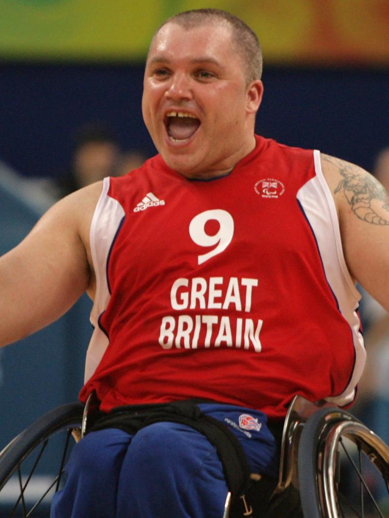 A picture in a wheelchair celebrating a victory