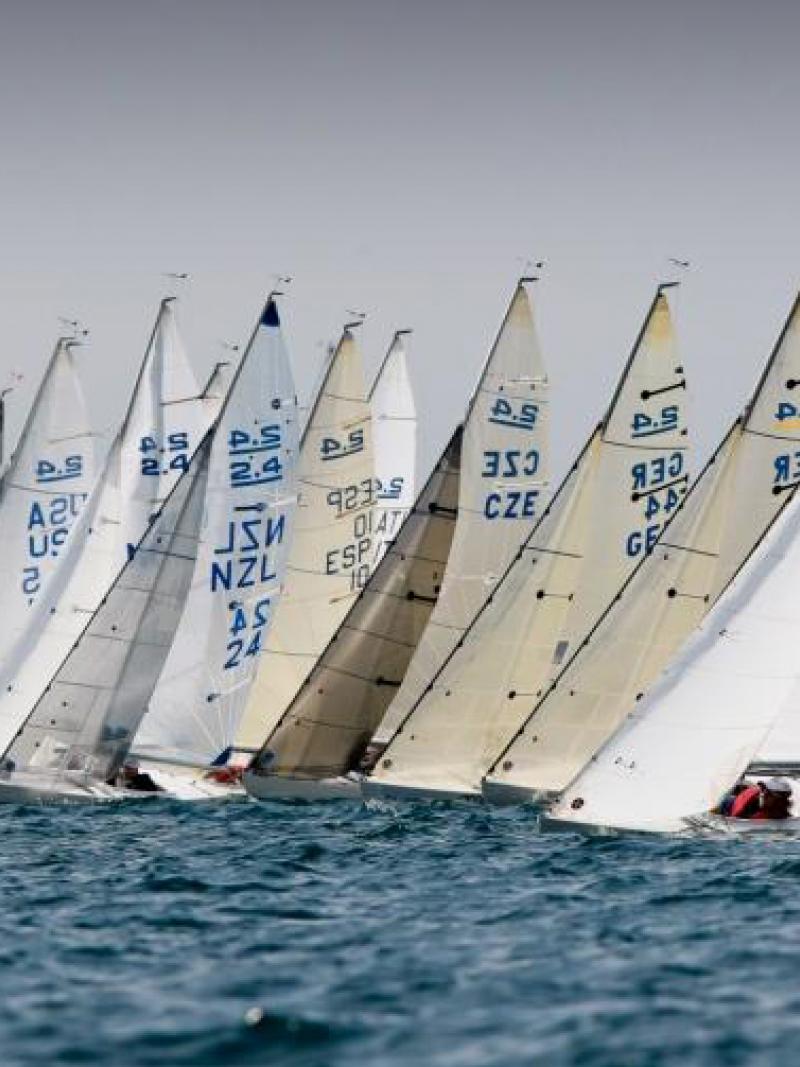 A group of 2.4mR boats lined up in a row