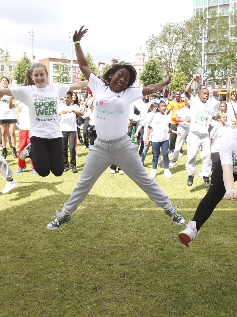 A picture of children jumping in a group picture