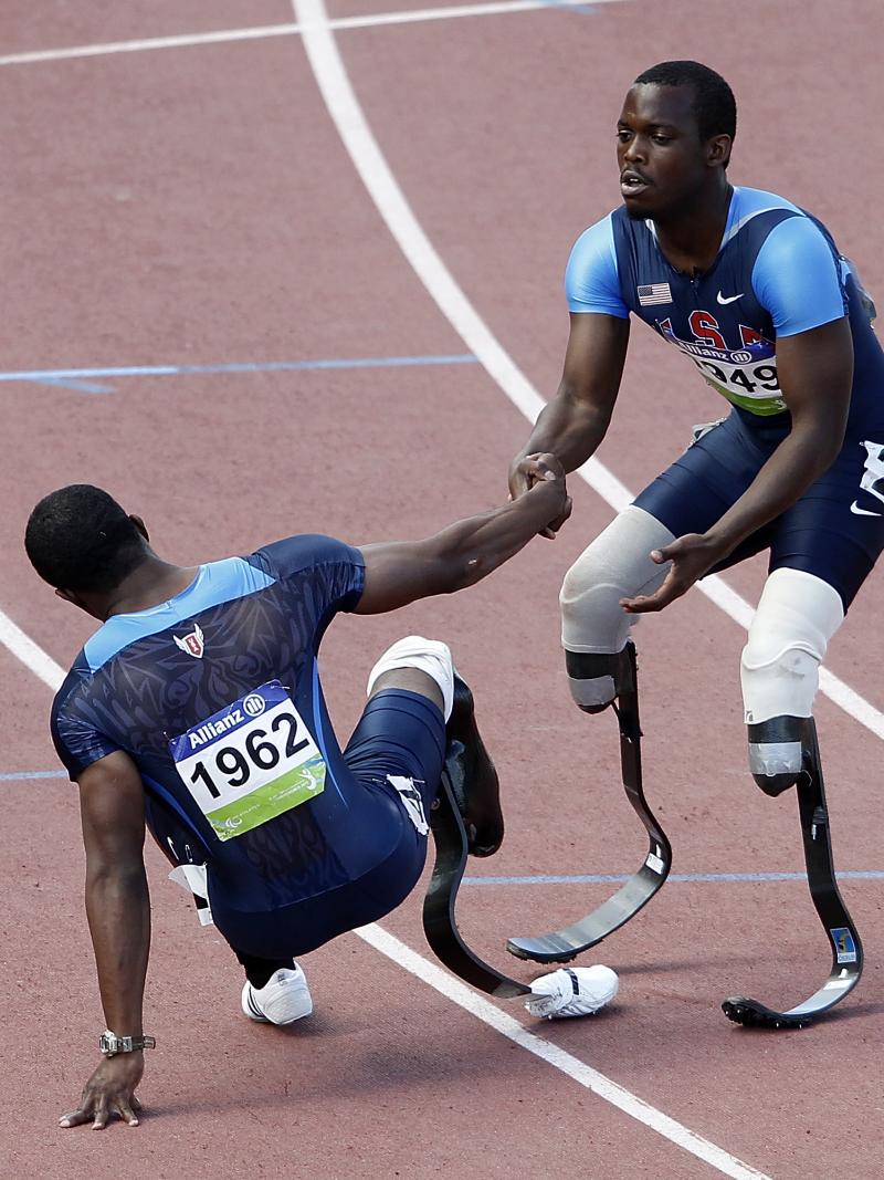 USA's Blake Leeper give teammate Jerome Singleton a helping hand