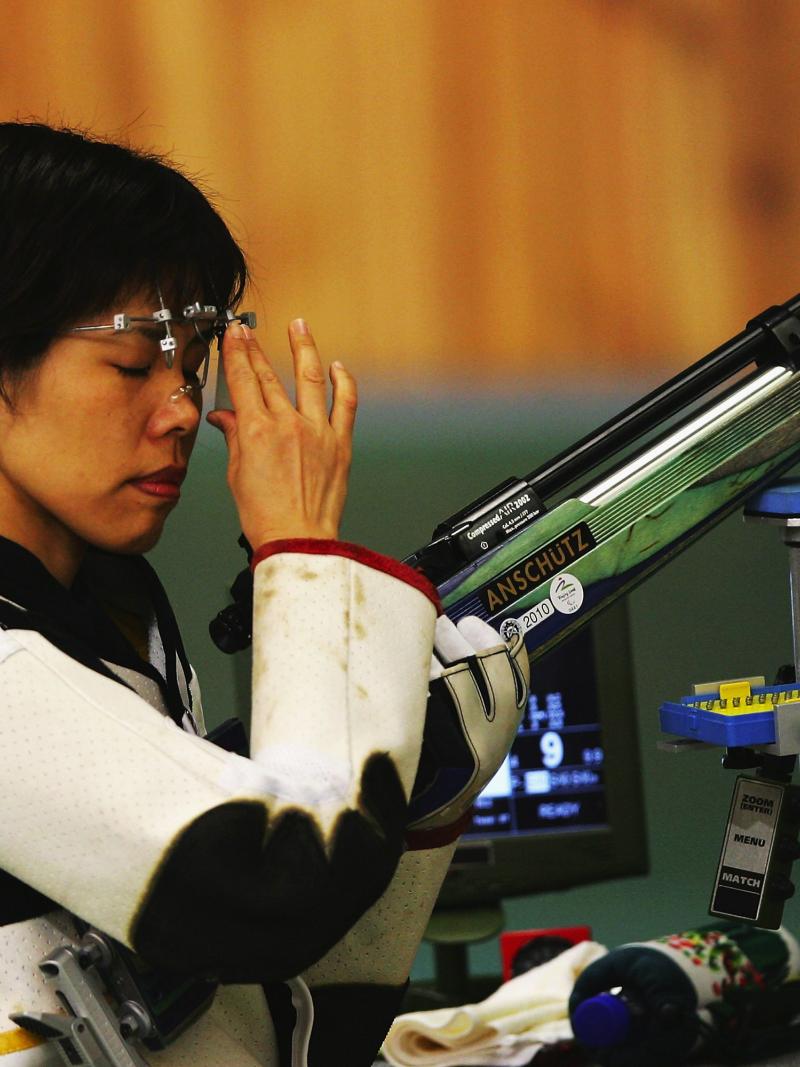 A picture of a girl holding a gun