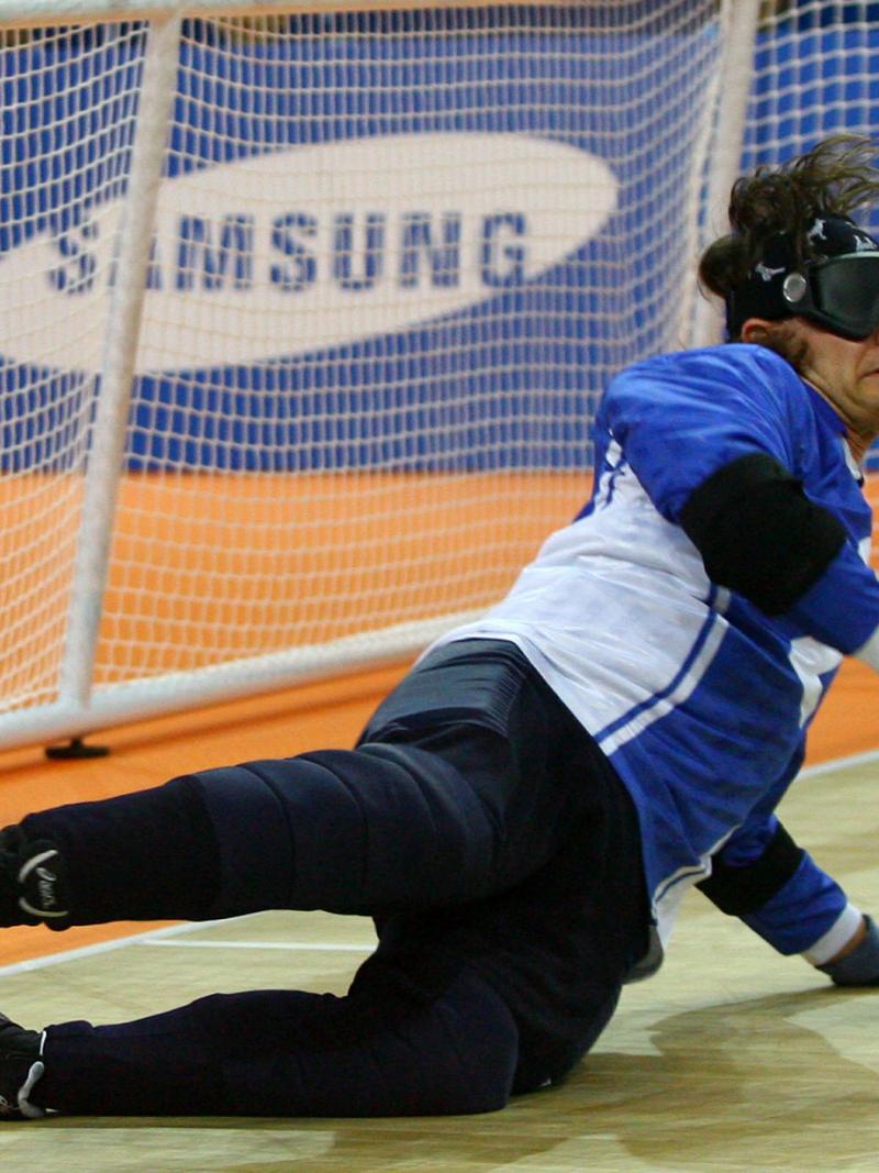A picture of a blind men playing Goalball