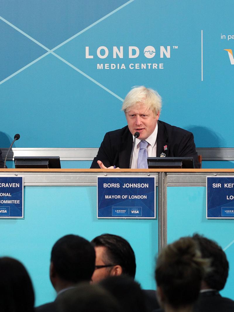 A picture of 3 person sit down together and discussing