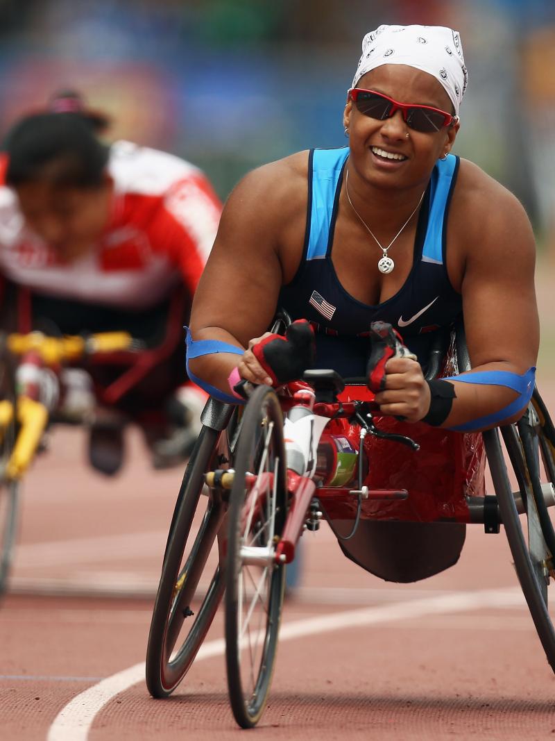 A picture of a woman in wheelchair celebrating her victory