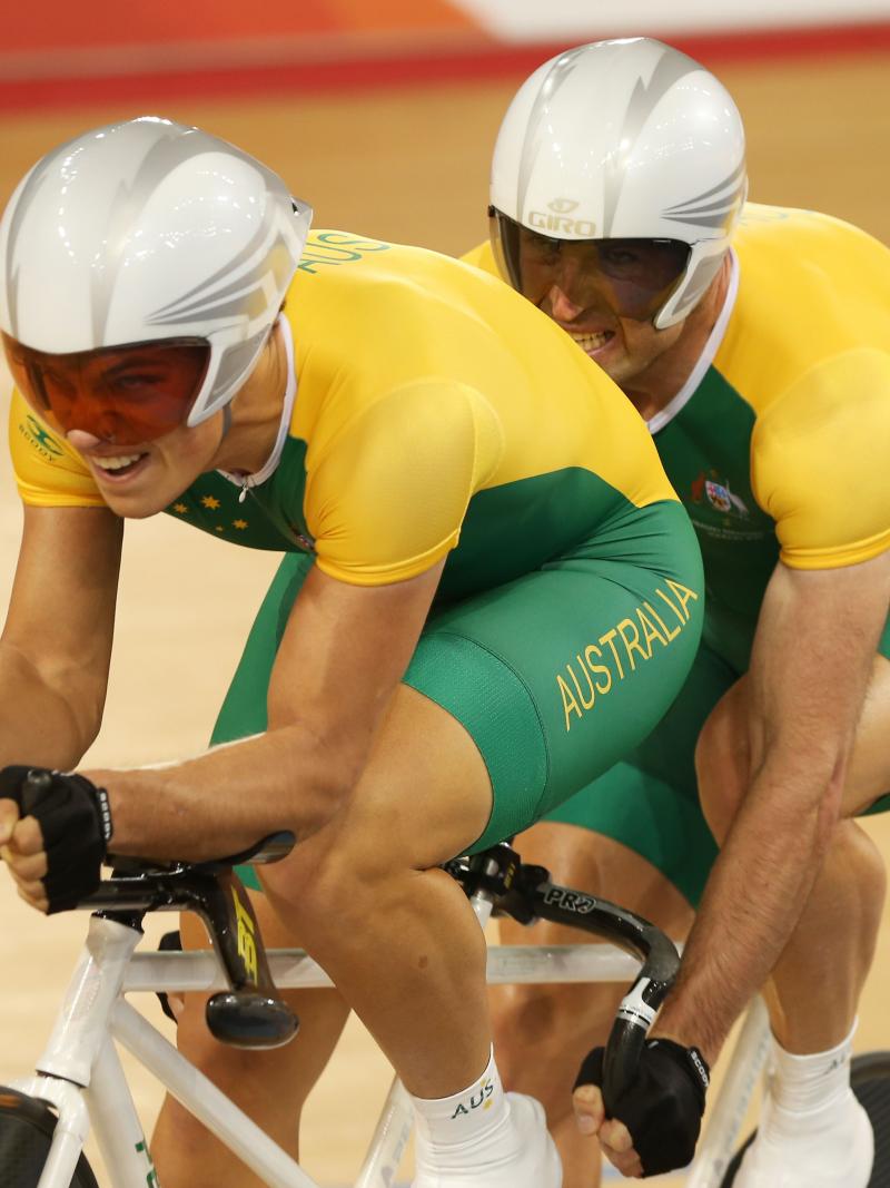 A picture of a two man cycling wit the same bicycle