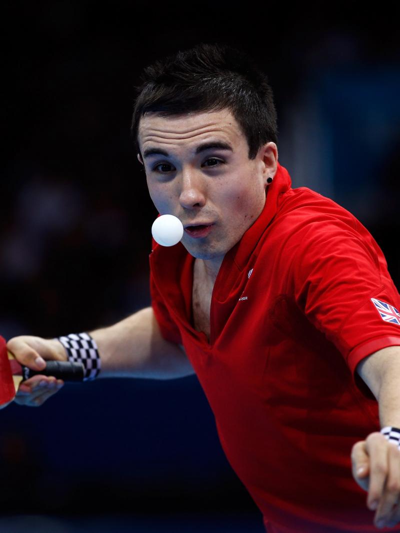 A picture of a man playing table tennis