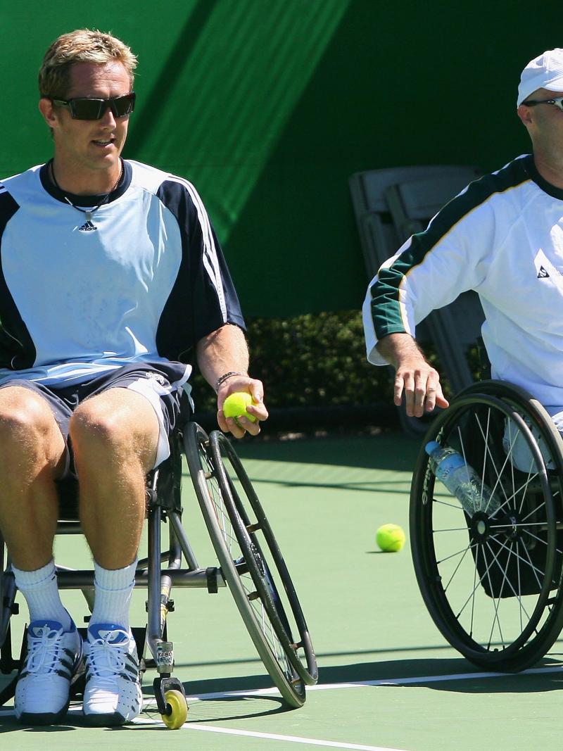 Wheelchair tennis legend David Hall (right) introduces Jonas Bjorkman to the sport (left)