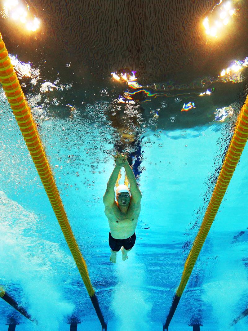 A picture of three men underwater