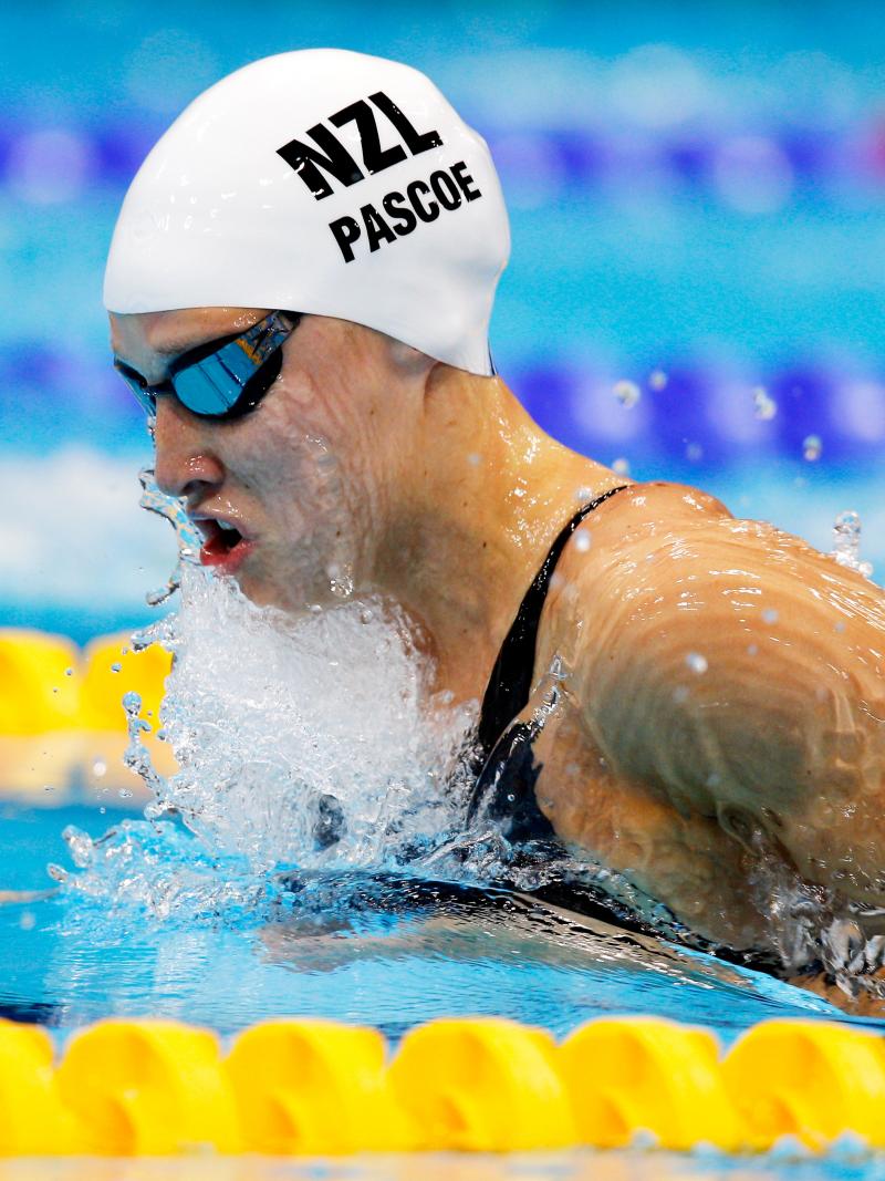 A picture of a woman in the pool with her head and shoulders above the surface