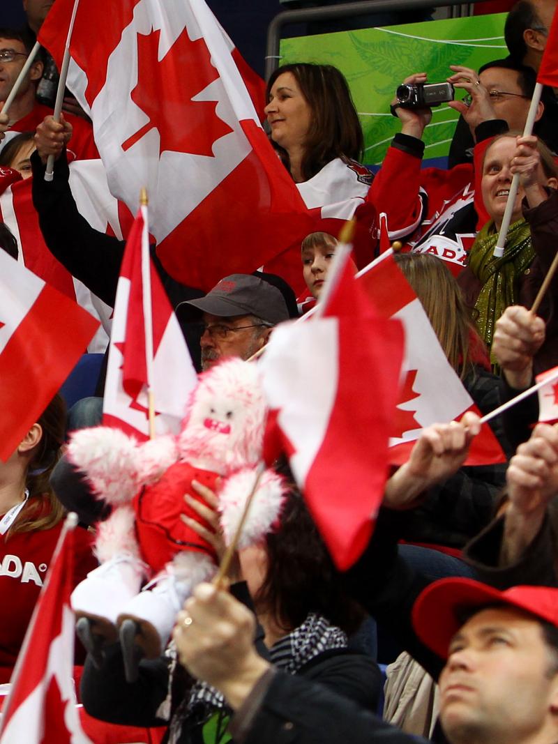 A picture of supporters waving canadian flags