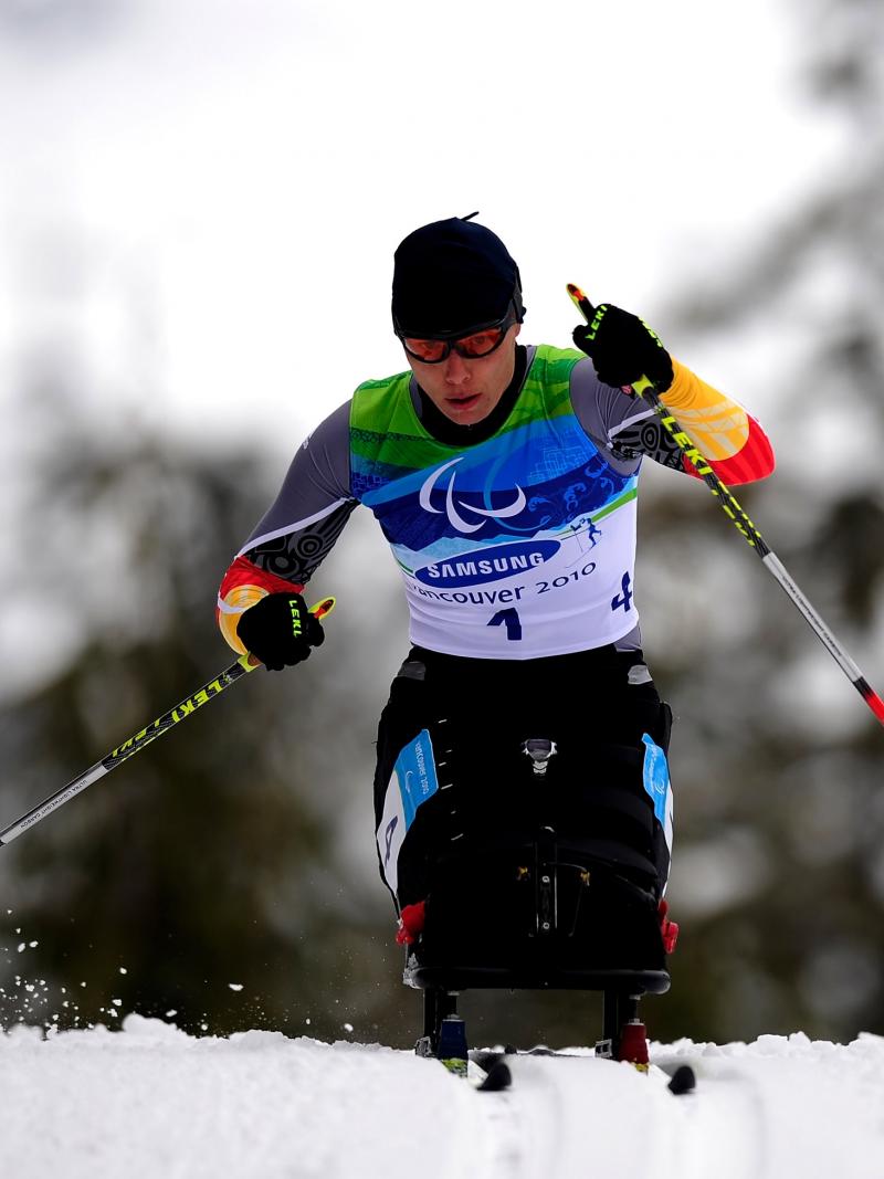 A woman in the wheelchair at the biathlon track