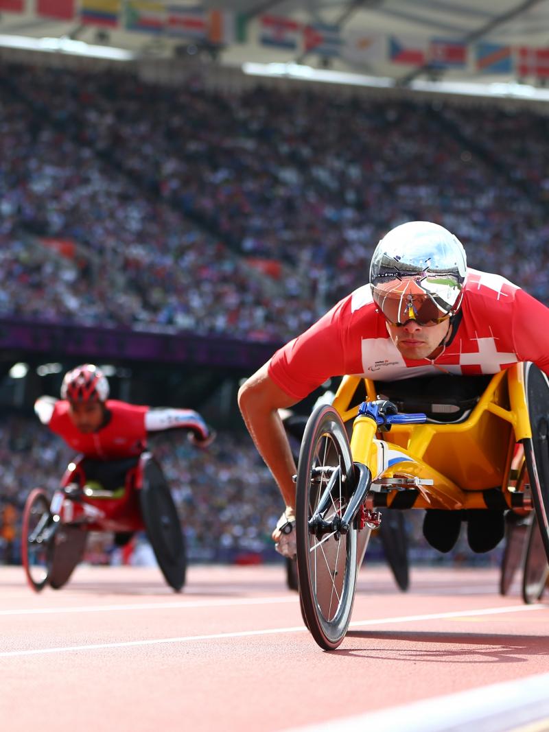 A picture of a man in a wheelchair on a track