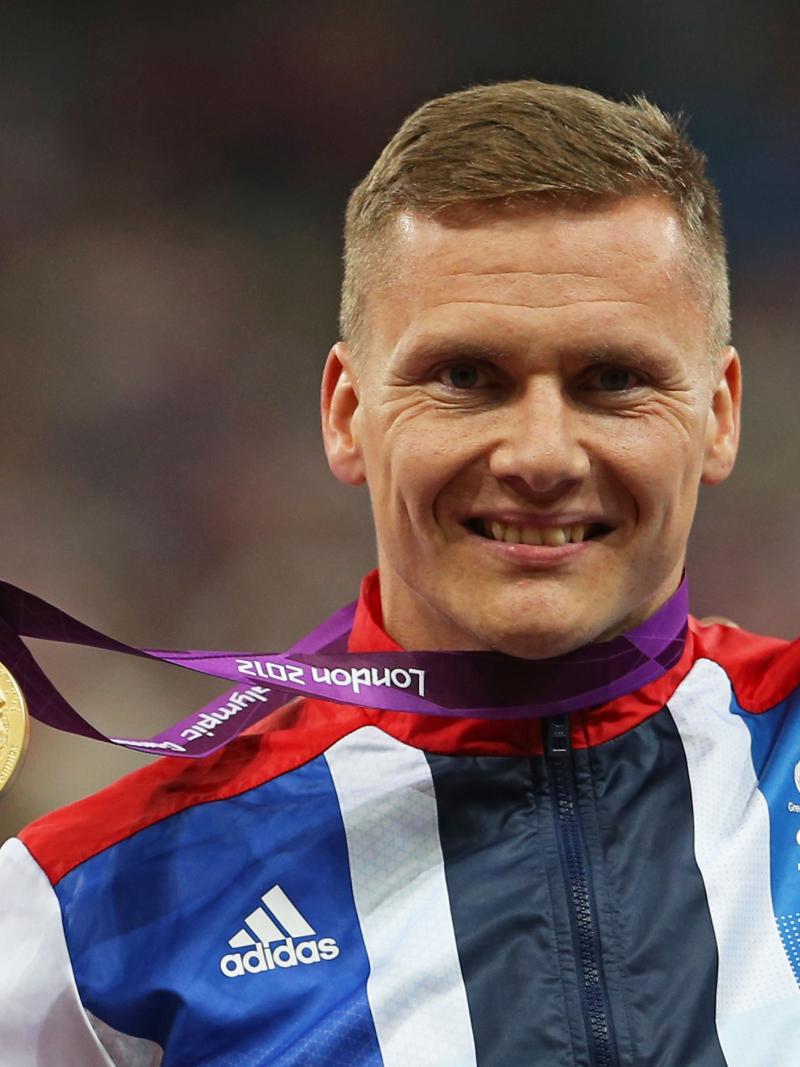 A picture of a man with a medal around his neck