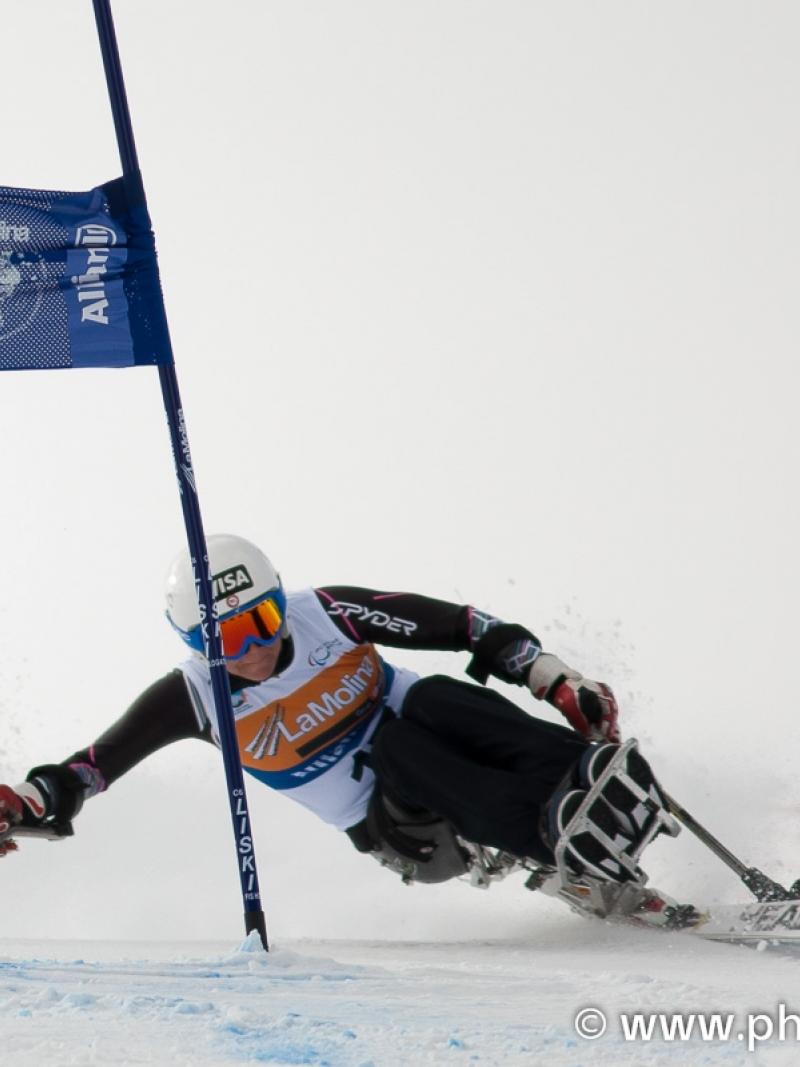 A picture of a woman skiing on the slopes
