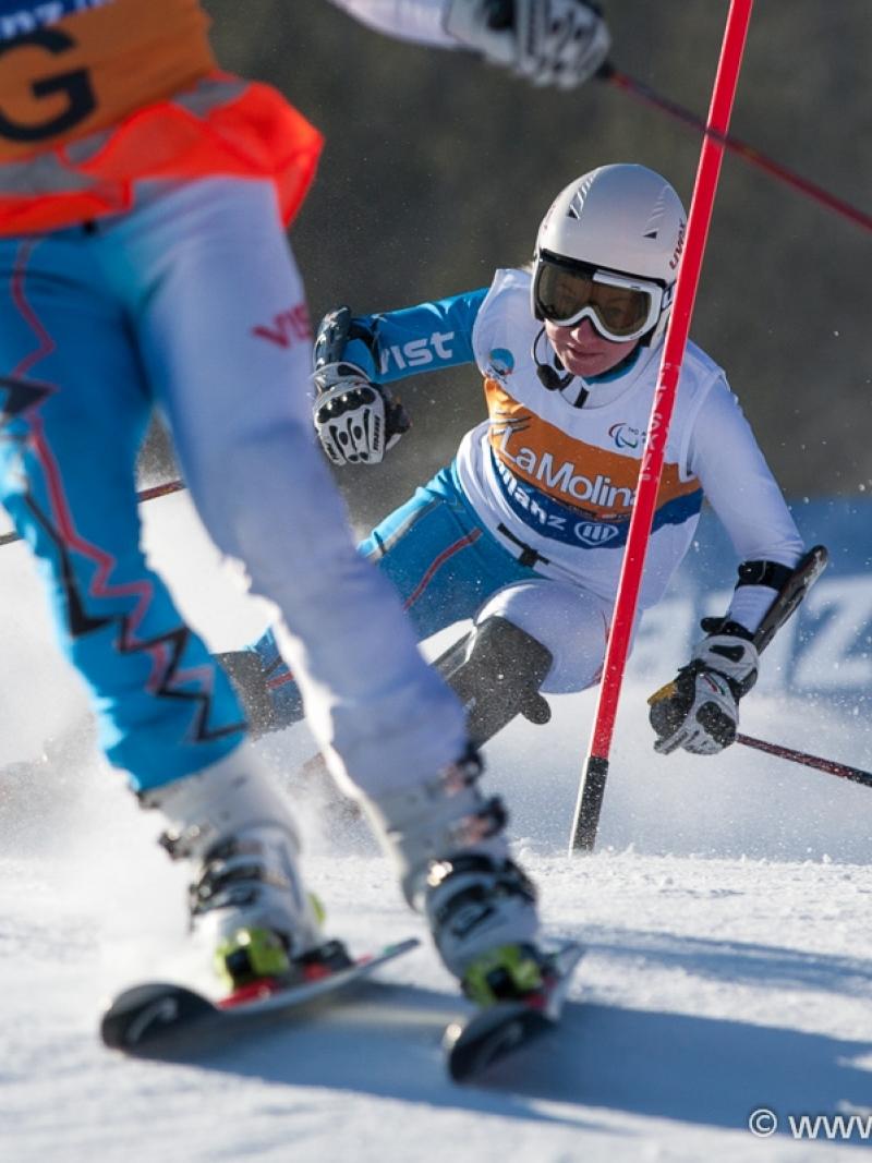 A picture of a woman skiing on the slopes