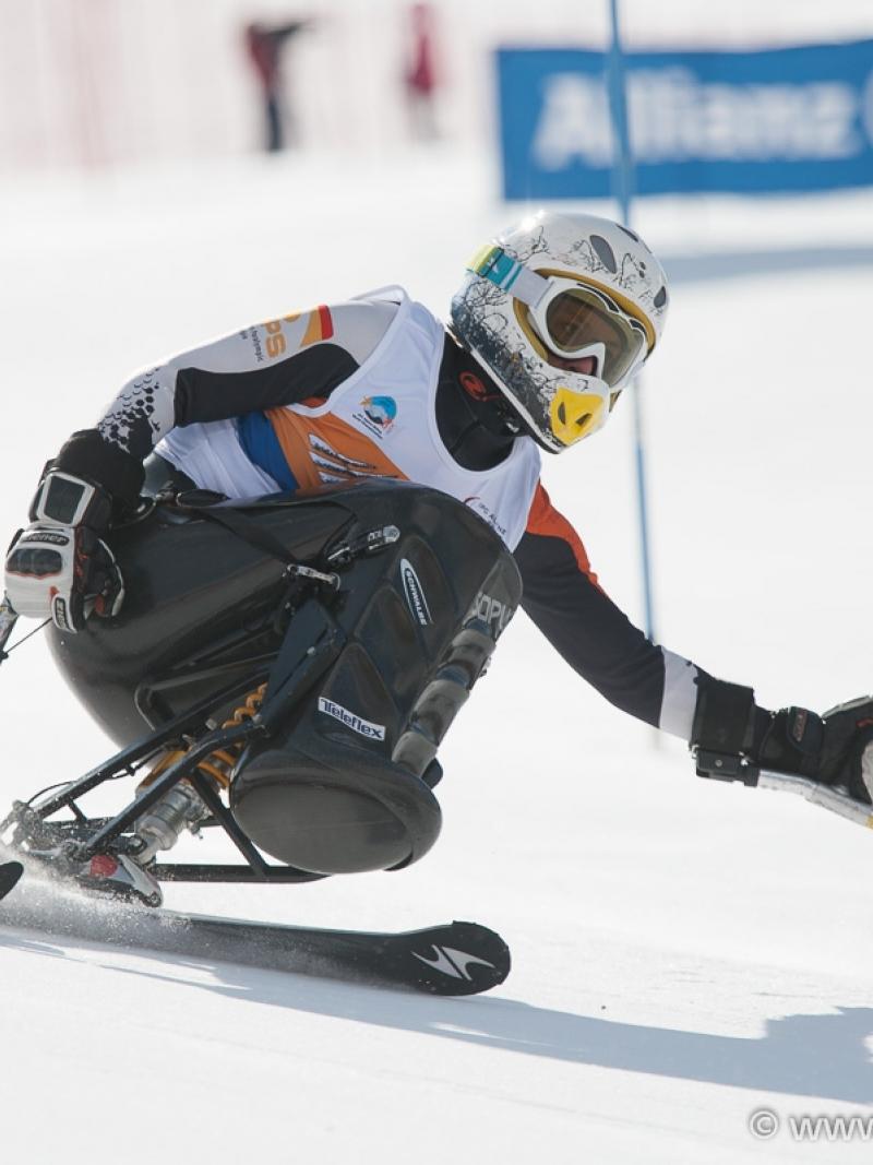 A picture of a woman skiing on the slopes