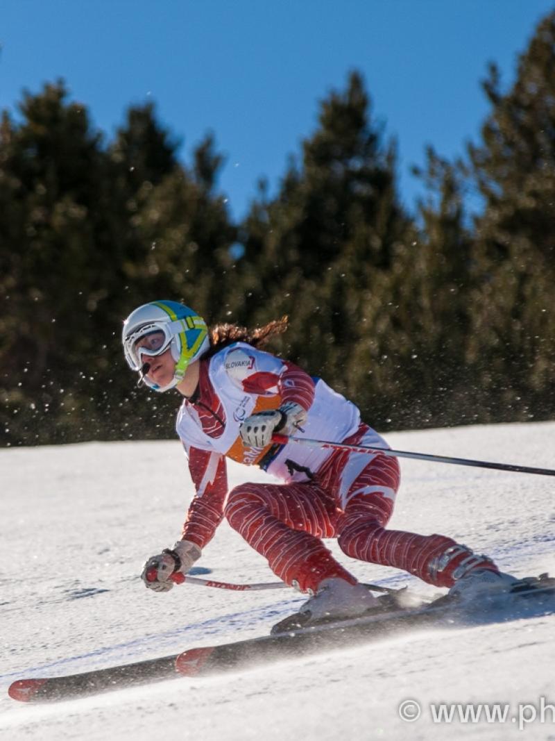 A picture of a woman skiing on the slopes