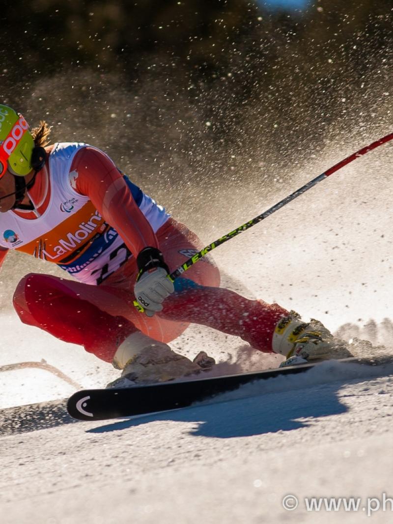 A picture of a man skiing on the slopes