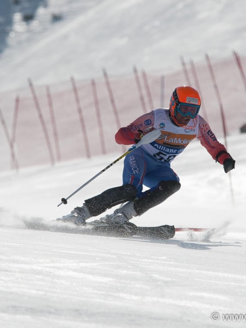 A picture of a man skiing on the slopes