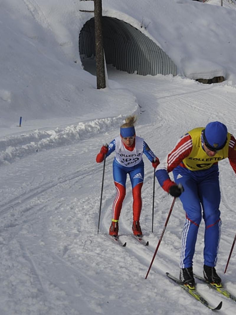 A picture of a woman skiing on a track