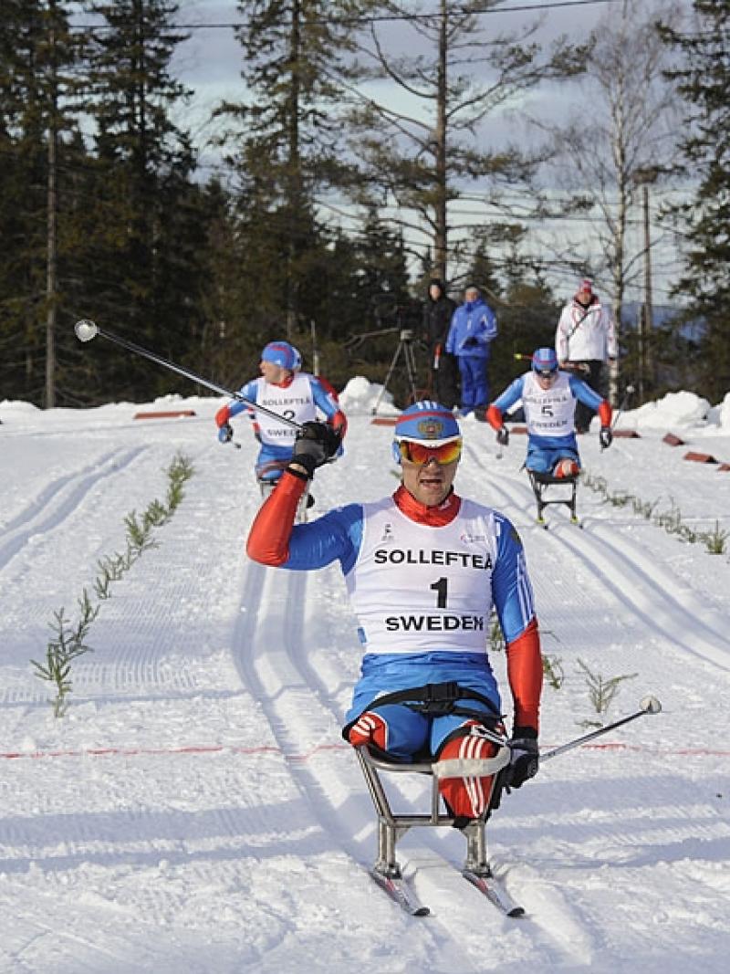 A picture of a man celebrating after crosses the finish line