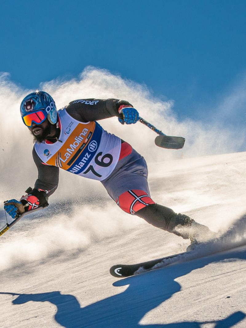 A picture of a man skiing on the slopes